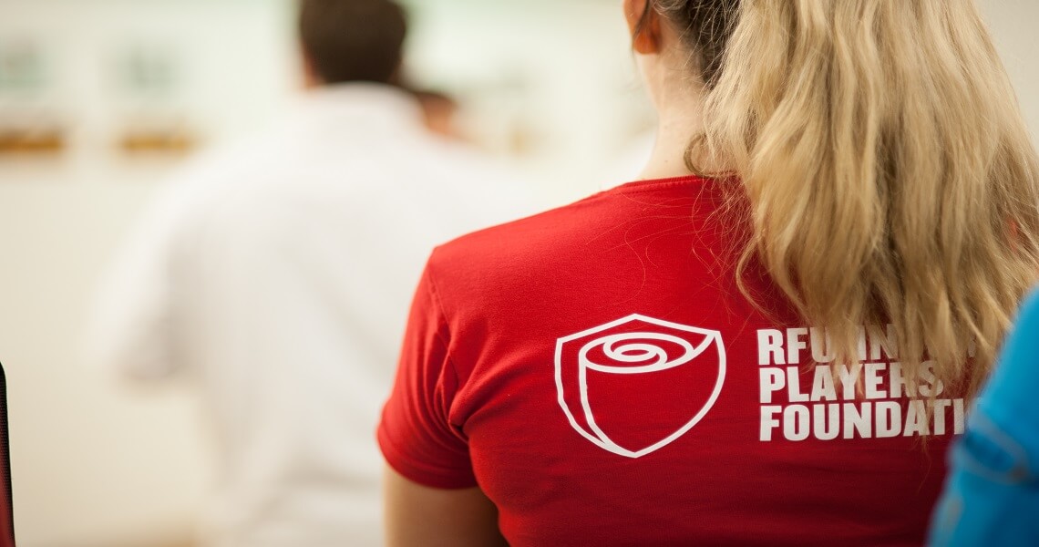 Person's back in an IPF T-shirt