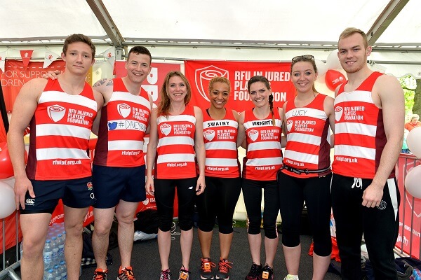 Group of people wearing RFU Injured Players Foundation vests