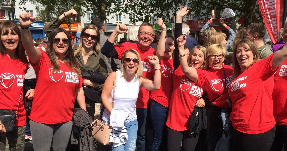 Crowd  of people in RFU Injured Players Foundation tops